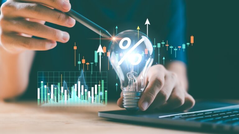 Creative,Finance,Idea,With,Glowing,Bulb,And,Candlestick,Chart,Shows