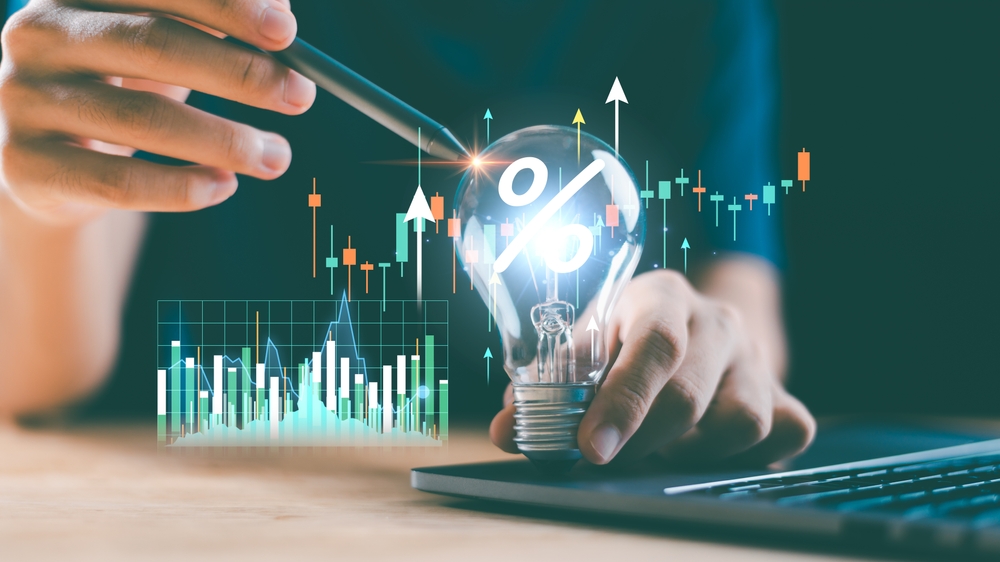 Creative,Finance,Idea,With,Glowing,Bulb,And,Candlestick,Chart,Shows