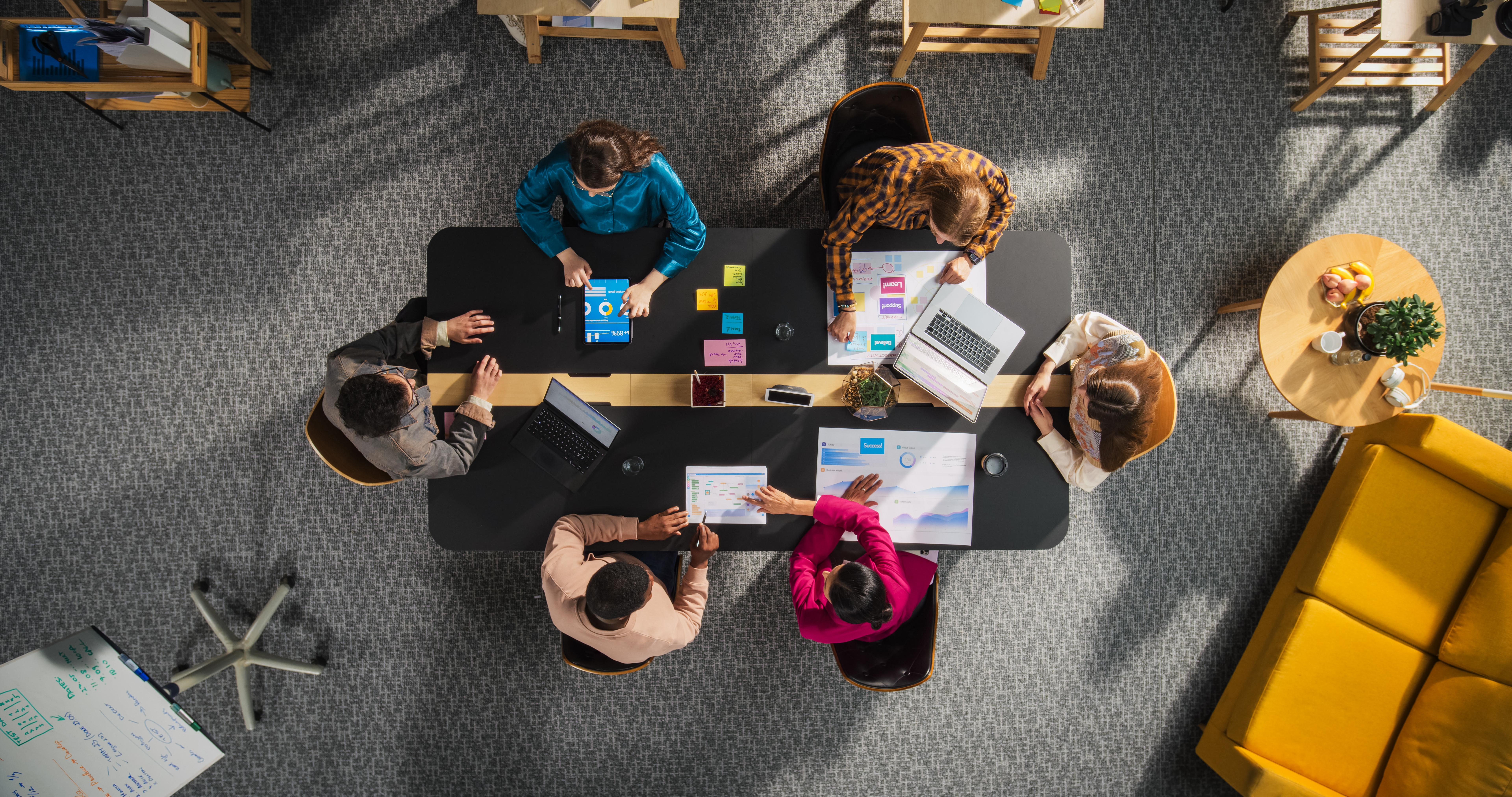 Startup,Meeting,Room:,Team,Of,Entrepreneurs,Sitting,Around,Conference,Table,