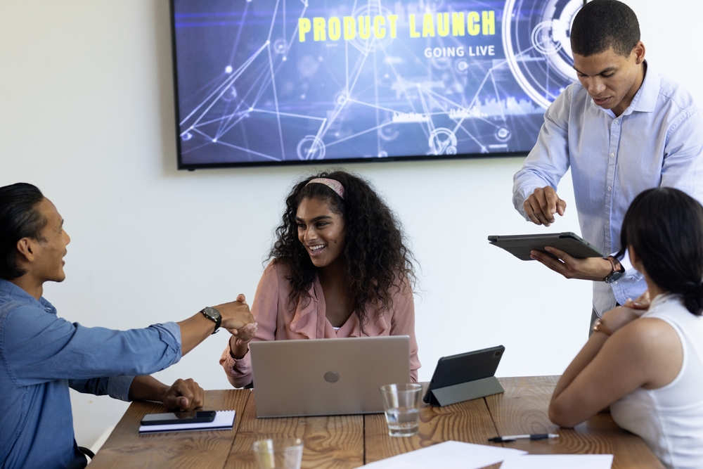 Diverse,Business,Team,Collaborating,On,Product,Launch,Presentation,In,Modern